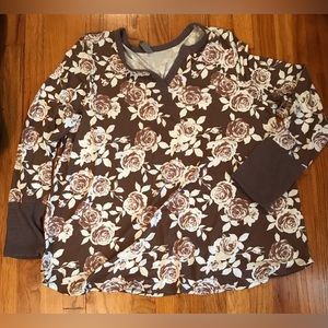 Long sleeve white floral print on taupe background.